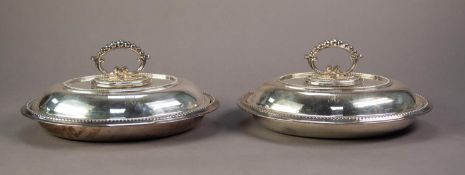 A PAIR OF ELECTROPLATE OVAL ENTREE DISHES AND COVER, with removable handles with beaded borders ,
