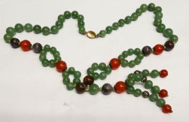 NECKLACE OF MAINLY JADE GREEN HARDSTONE BEADS, with some ORANGE and some BROWN beads, silver gilt o