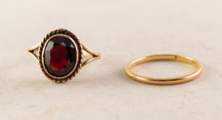 22ct GOLD WEDDING RING, 1.6gms and a 9ct GOLD DRESS RING, collet set with an oval garnet, 3gms