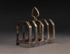 GEORGE V SILVER FOUR DIVISION TOAST RACK, of angular form with top handle, 4? x 2 ½? (10.2cm x 6.