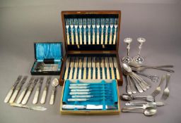 EDWARDIAN WALNUT CASE containing 12 PAIRS OF ELECTROPLATE KNIVES AND FORKS with engraved blades,