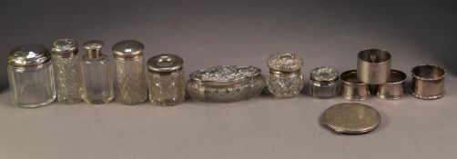 EIGHT VARIOUS EARLY 20th CENTURY SILVER TOPPED BOTTLES AND JARS; FOUR SILVER NAPKIN RINGS, various