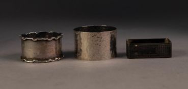 THREE SILVER NAPKIN RINGS, including an OBLONG, ENGINE TURNED EXAMPLE and another, PLANISHED, by