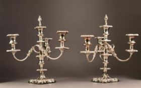 PAIR OF SILVER PLATED ON COPPER FIVE LIGHT, FOUR BRANCH CANDELABRA, each with fancy scroll