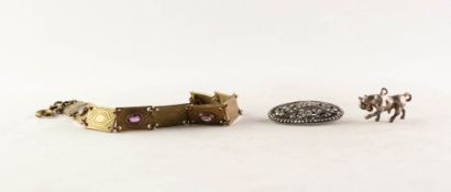 SILVER AND MARCASITE OVAL BROOCH; SILVER BULL CHARM and a gilt metal BRACELET with 9 panel links set