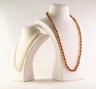 SINGLE STRAND NECKLACE of sparkling amber uniform round beads and a TWO STRAND NECKLACE of Shima