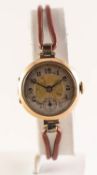 PRE-WAR 9ct GOLD CASED LADY'S WRISTWATCH with arabic numerals and leather strap, 15.8gms gross