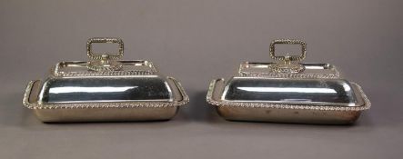 PAIR OF WALKER AND HALL ELECTROPLATE OBLONG ENTREE DISHES AND COVER, with removable handles, bold