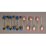 SET OF SIX GUILLOCHE ENAMELLED AND SILVER COLOURED METAL GILT COFFEE SPOONS, each enamelled in