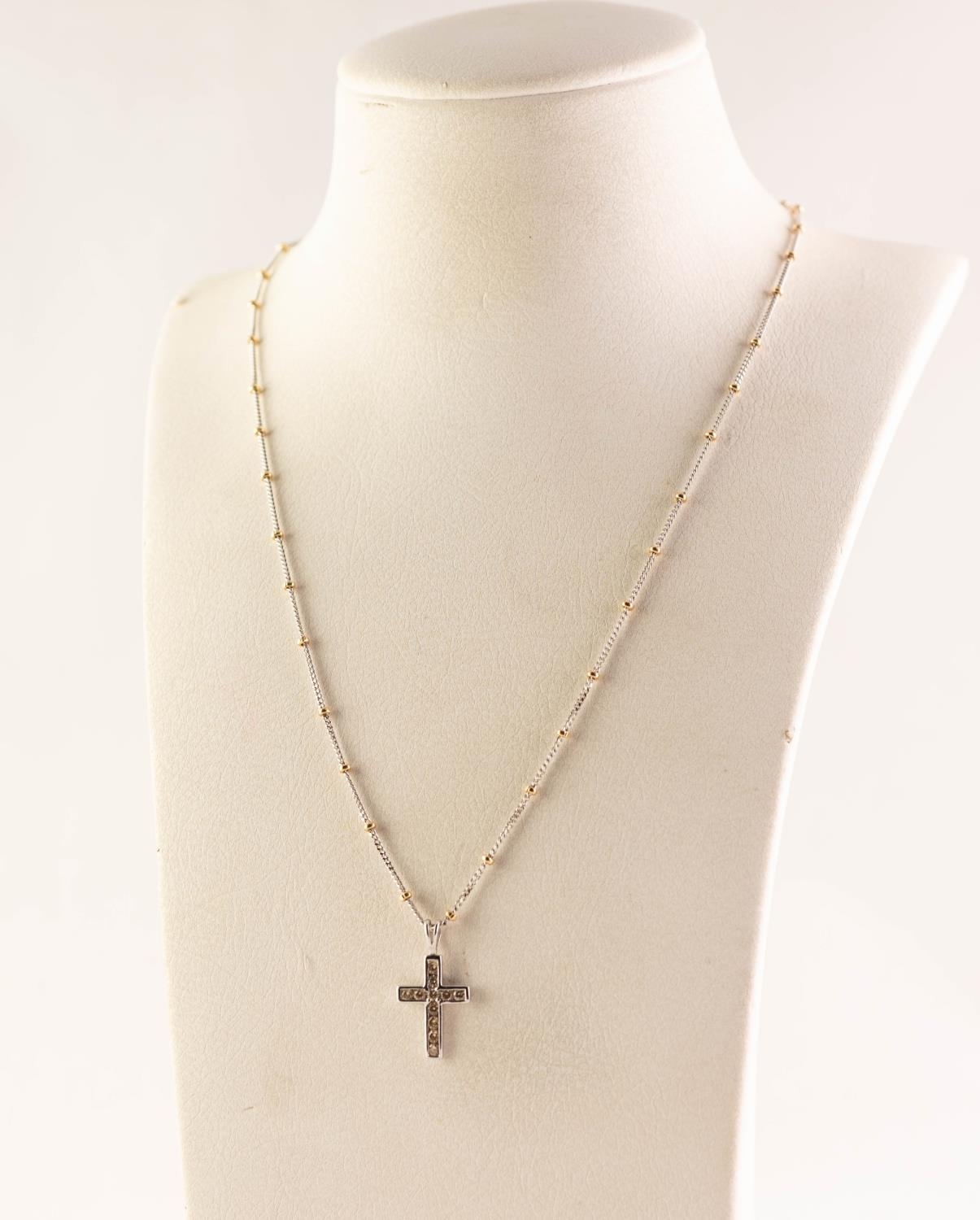 18ct WHITE GOLD TINY DIAMOND SET CRUCIFIX PENDANT on an 18ct WHTIE AND YELLOW GOLD FINE CHAIN
