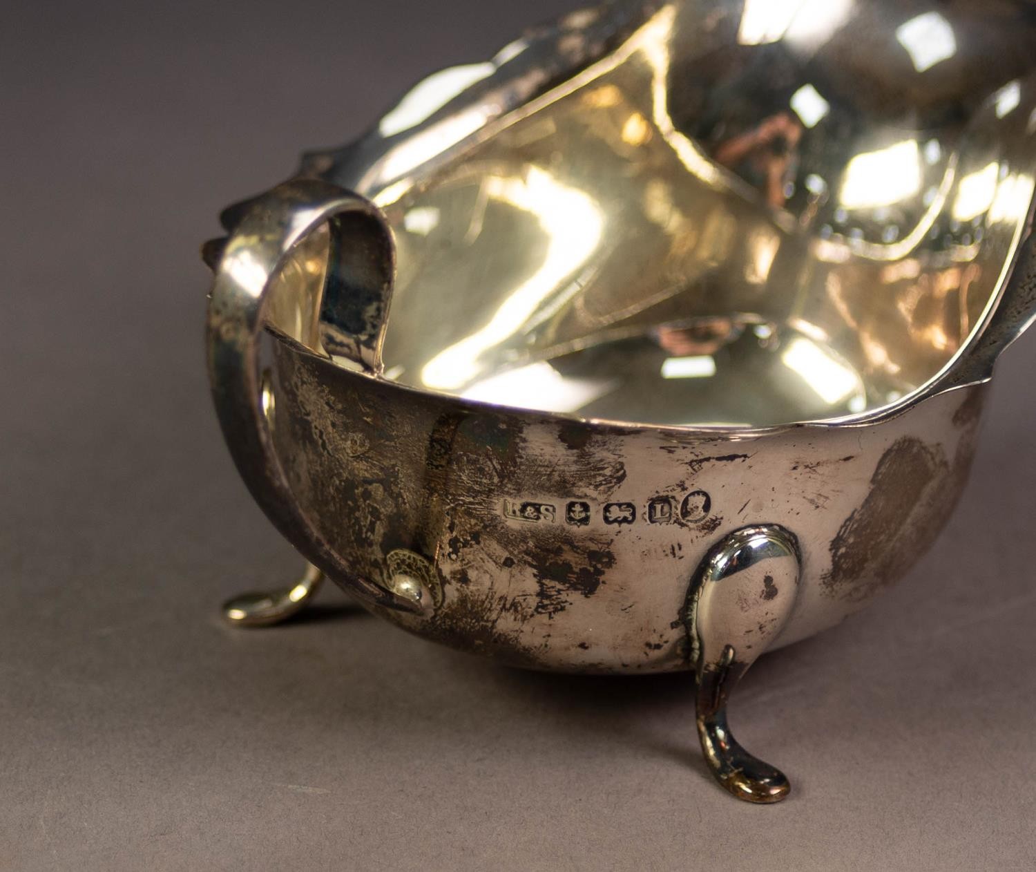 GEORGE V SILVER SAUCE BOAT, with cyma border, high scroll handle and pad feet, 6? (15.2cm) long, - Image 2 of 3