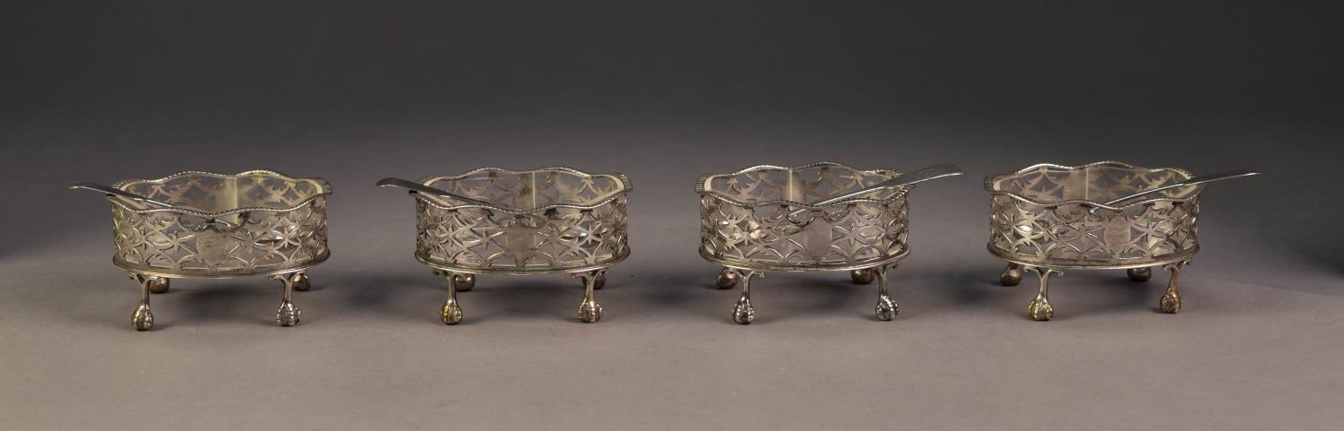 SET OF FOUR EARLY 20th CENTURY SILVER OPEN WORK SALT CELLARS, oval and gadroon rimmed, (the original