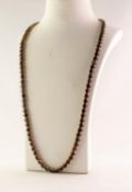 CONTINENTAL GOLD PLATED SINGLE STRAND NECKLACE each link set with an oval garnet, 28in (71cm)