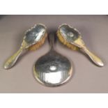 LADY'S ENGINE TURNED SILVER HAND MIRROR, Birmingham 1911 and A PAIR OF LADY'S SILVER HAIR BRUSHES,