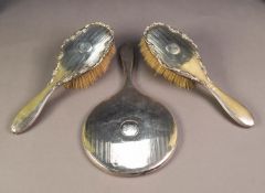 LADY'S ENGINE TURNED SILVER HAND MIRROR, Birmingham 1911 and A PAIR OF LADY'S SILVER HAIR BRUSHES,