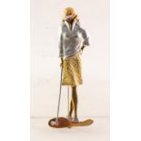 18ct THREE-COLOUR GOLD BROOCH IN THE FORM OF A LADY GOLFER, leaning on her golf club, 2 3/8in (
