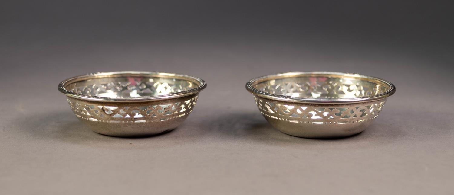 PAIR OF SILVER CIRCULAR SWEET MEAT DISHES, with cut card pierced sides, reed and ribbon borders, 3