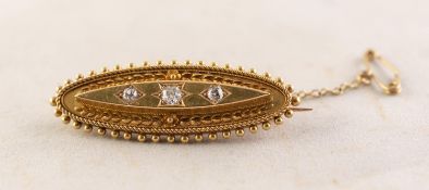 LATE VICTORIAN 15ct GOLD LOZENGE SHAPED BROOCH, with three old cut diamonds in star settings, with