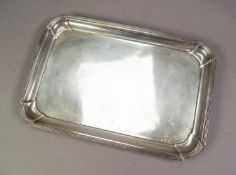 GEORGE V PLAIN SILVER DRESSING TABLE TRAY, of oblong form with cavetto border, 12? x 8? (30.5cm x