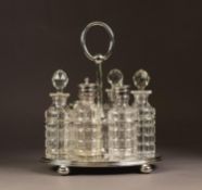 ELECTROPLATED SIX BOTTLE CRUET STAND, of oval form with moulded border, compressed ball feet and lo