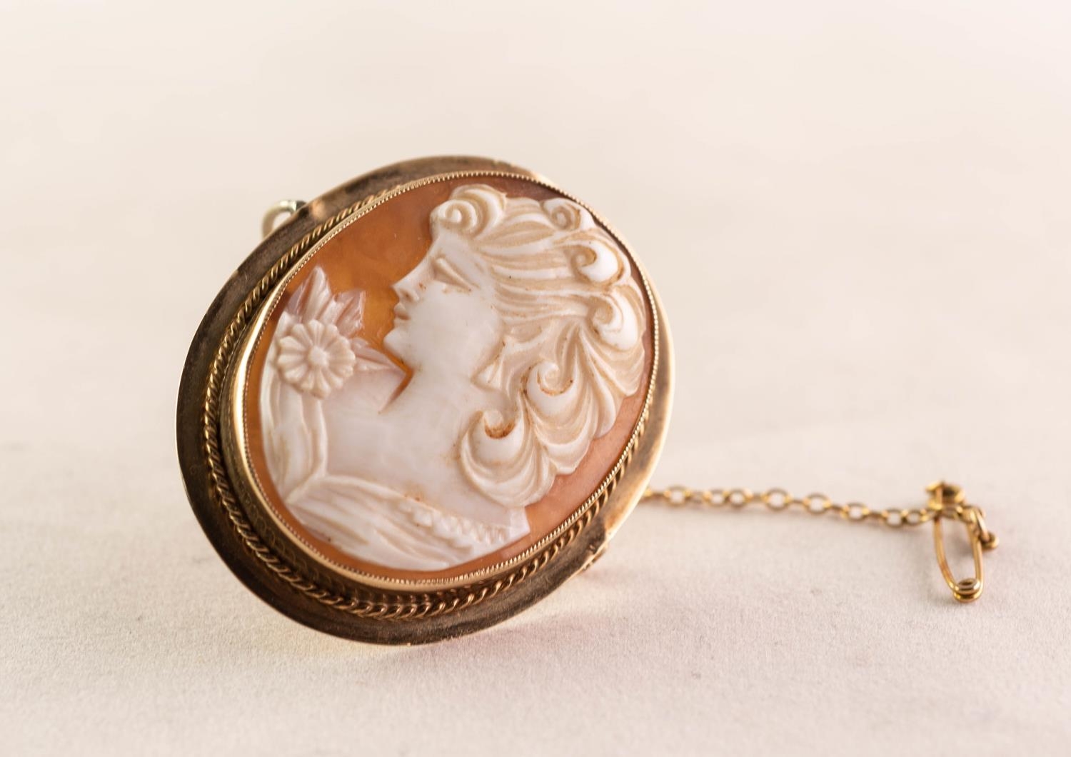OVAL SHELL CAMEO BROOCH depicting a bust portrait of a lady, in 9ct GOLD FRAME, 1 1/2in (4cm) high