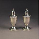 PAIR OF 'STERLING' PATENT WEIGHTED PEPPER AND SALT RECEIVERS, with glass liner, urn shaped with