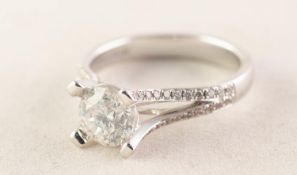 18ct WHITE GOLD RING WITH A ROUND BRILLIANT CUT SOLITAIRE DIAMOND, in high four post setting,