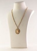 9ct GOLD PENDANT set with a small carved oval shell cameo and the gold coloured metal BELCHER