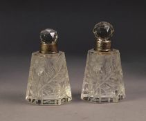 GEORGE V PAIR OF CUT GLASS SCENT BOTTLES WITH STOPPERS AND SILVER COLLARS, each of tapering