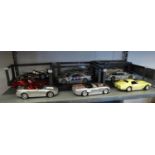 NINE VARIOUS SCALE MODEL CLASSIC AND SPORTS CARS TO INCLUDE; CORVETTE, PORSCHE 911 GTI, MERCEDES