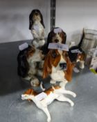 A SET OF FOUR SYLVAC POTTERY COMIC MODELS OF DOGS AND A BESWICK CHINA DACHSHUND (5) (A.F.)