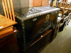 CHINESE CARVED CAMPHOR WOOD CHEST WITH LIFT-OUT TRAY, THE LID AND FRONT CAVO RELIEVO IN TRIANGULAR