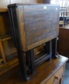 AN OAK OBLONG SWING LEGGED SUTHERLAND TABLE