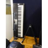 A CASIO LK-170 ELECTRONIC KEYBOARD AND A GUITAR STAND (2)