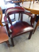 A GOOD QUALITY DARK RED LEATHER TUB SHAPED DESK CHAIR, RAISED ON STRAIGHT REEDED LEGS