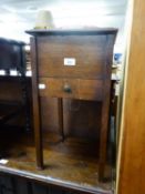 AN OAK SQUARE FLOOR STANDING WORK BOX, WITH HINGED LID AND DRAWER BELOW, PLUS CONTENTS