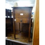 AN OAK SQUARE FLOOR STANDING WORK BOX, WITH HINGED LID AND DRAWER BELOW, PLUS CONTENTS