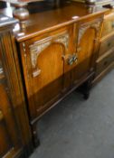 JACOBEAN STYLE OAK SMALL CUPBOARD, WITH TWO ARCH CARVED OAK DOORS, BALUSTER LEGS