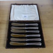 A SET OF SIX AFTERNOON TEA KNIVES WITH SILVER HANDLES, IN CASE
