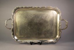 ELECTROPLATED TWO HANDLED LARGE TEA TRAY, of rounded oblong form with foliate scroll chased centre