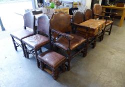A SET OF SIX OAK REFECTORY STYLE DINING CHAIRS, THE BACK AND SEATS COVERED IN BROWN HIDE WITH
