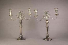PAIR OF 20th CENTURY ELECTROPLATED CANDLESTICKS with removable three-light twin branch reflex candle