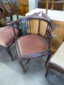 AN EARLY 20TH CENTURY DARK MAHOGANY CORNER ARMCHAIR