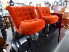 A PAIR OF OLIVER BONAS TUB EASY CHAIRS, COVERED IN CRIMSON VELVET, ON SQUARE TAPERING LEGS