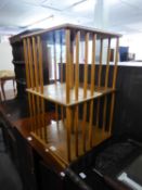 A LIGHT OAK SQUARE REVOLVING BOOKCASE, ON PLATFORM BASE, 1?4? WIDE