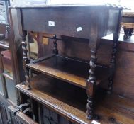 JACOBEAN STYLE OAK OCCASIONAL TABLE, THE BOX TOP WITH HINGED LID, WAVY EDGE, ON FOUR SPIRALLY