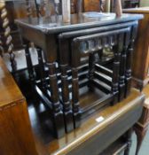 A NEST OF THREE JACOBEAN STYLE DARK OAK OBLONG COFFEE TABLES