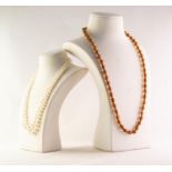 SINGLE STRAND NECKLACE of sparkling amber uniform round beads and a TWO STRAND NECKLACE of Shima