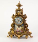 LATE NINETEENTH CENTURY GILT BRASS MANTLE CLOCK WITH HAND PAINTED SEVRES STYLE PORCELAIN PANELS, the