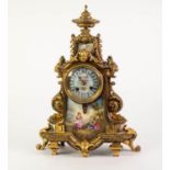 LATE NINETEENTH CENTURY GILT BRASS MANTLE CLOCK WITH HAND PAINTED SEVRES STYLE PORCELAIN PANELS, the